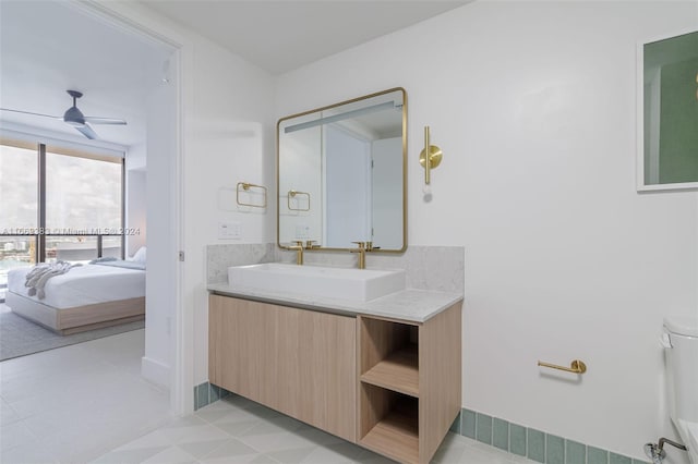 bathroom with tile patterned floors, ceiling fan, and vanity