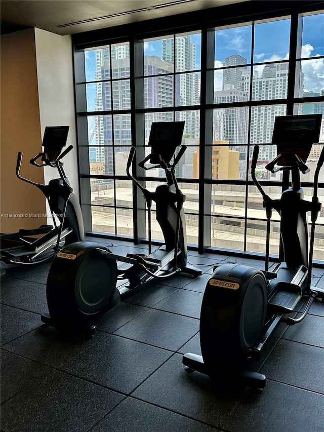 exercise room with floor to ceiling windows