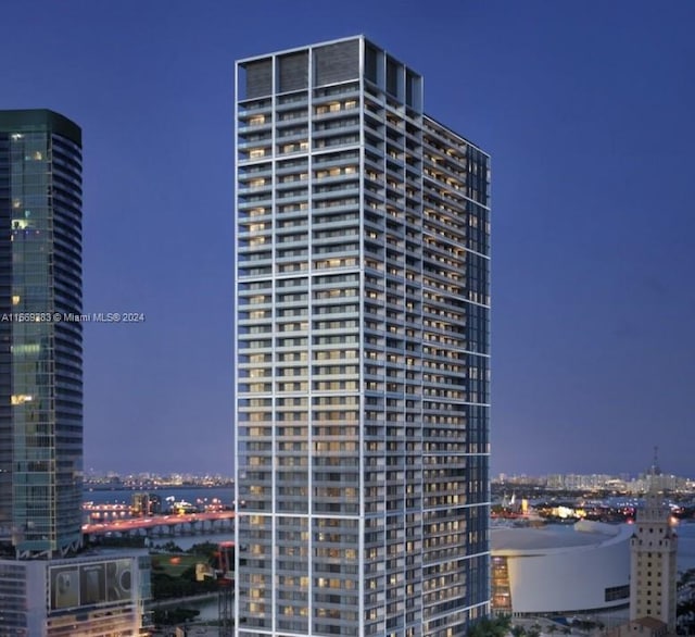 view of outdoor building at dusk