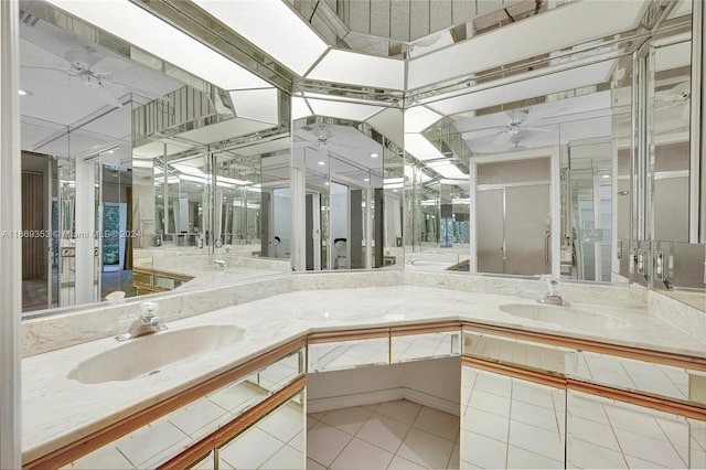 bathroom with ceiling fan, vanity, and tile patterned floors