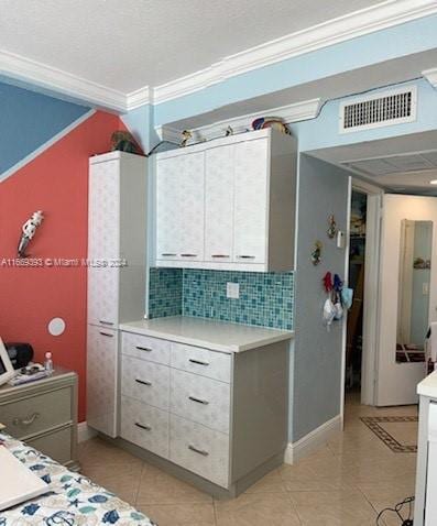 bedroom featuring crown molding and light tile patterned flooring