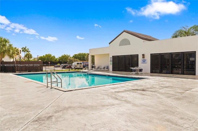 view of swimming pool featuring a patio