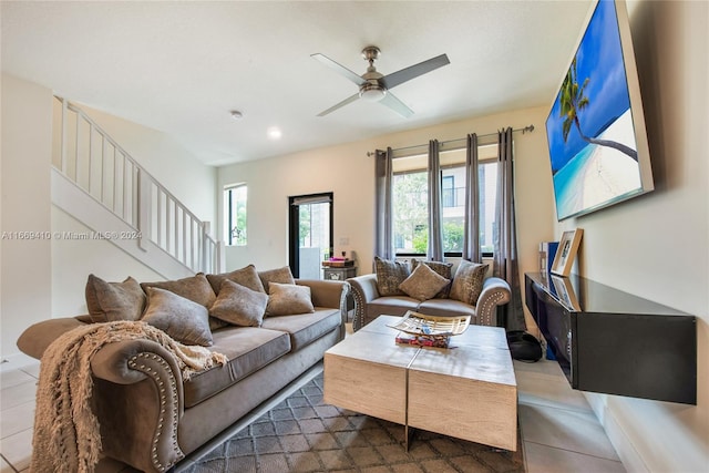 tiled living room with ceiling fan