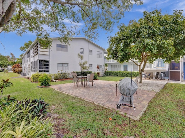 surrounding community featuring a lawn and a patio