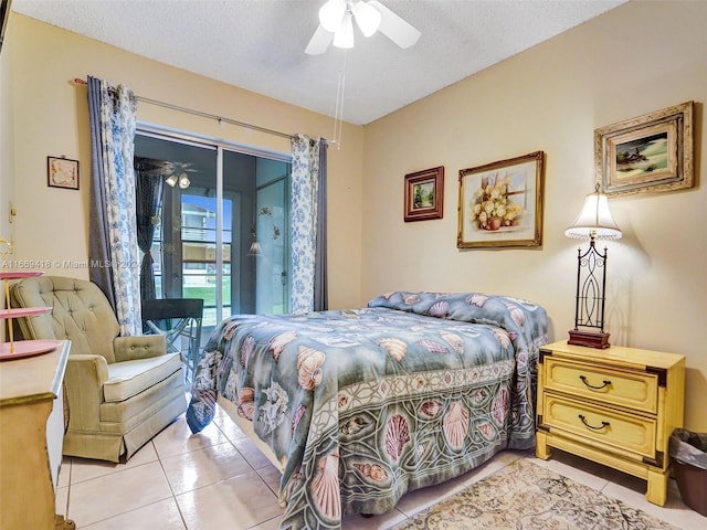 tiled bedroom with access to outside, a textured ceiling, and ceiling fan