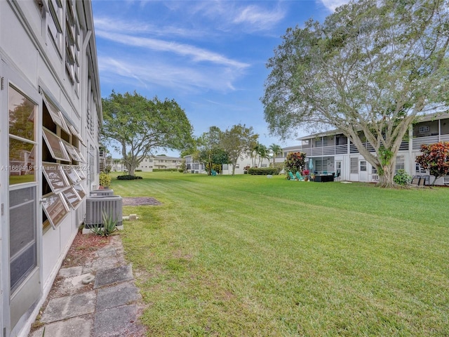 view of yard with central AC