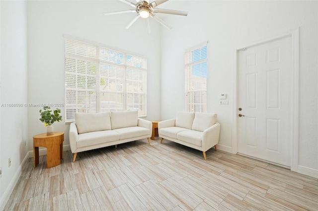 living area featuring ceiling fan