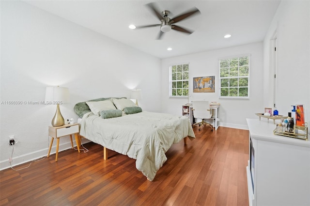 bedroom featuring dark hardwood / wood-style floors and ceiling fan