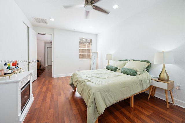 bedroom featuring ceiling fan and dark wood-type flooring