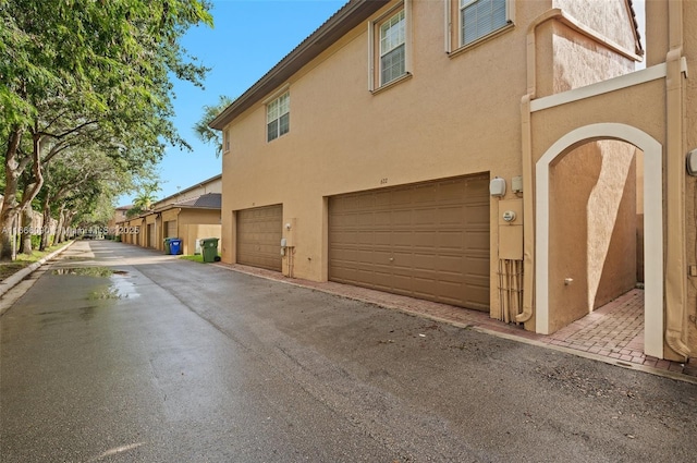 view of property exterior with a garage