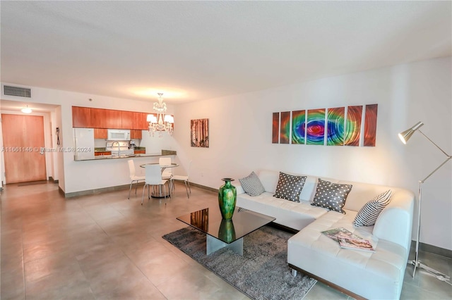 living room featuring an inviting chandelier