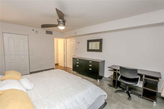 bedroom with ceiling fan and a closet