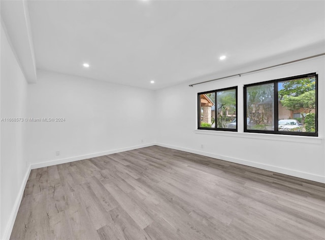 unfurnished room featuring light wood-type flooring