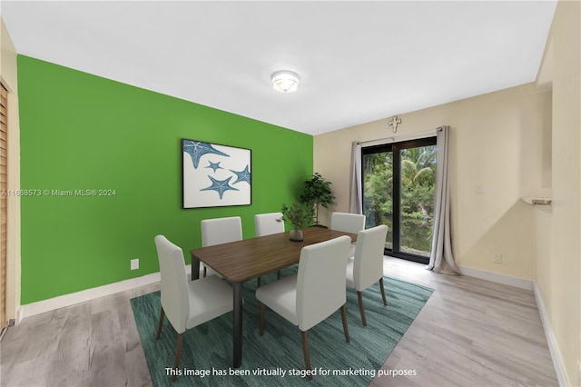 dining space with light wood-type flooring