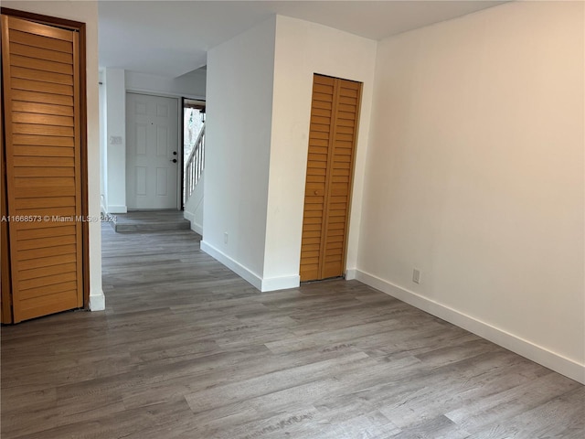 spare room with light hardwood / wood-style floors