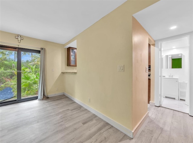 unfurnished room featuring light hardwood / wood-style floors