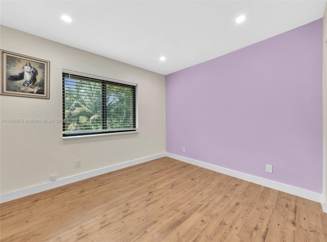 spare room featuring light hardwood / wood-style floors