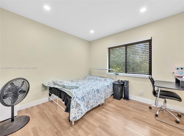 bedroom with light wood-type flooring