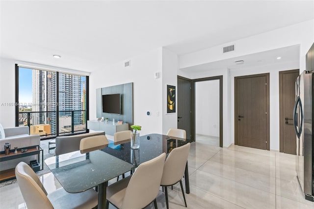 398 NE 5th St Unit 1419, Miami, FL 33132 - dining area with expansive windows, light tile patterned floors, and recessed lighting