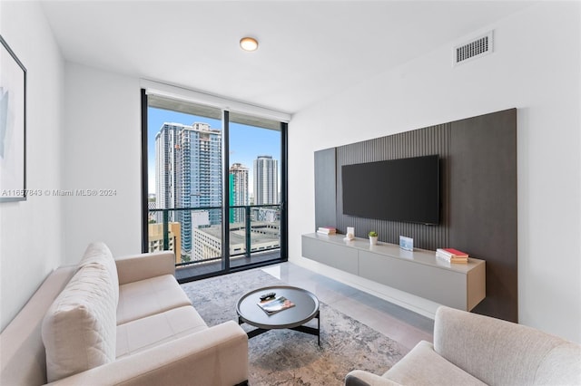 398 NE 5th St Unit 1419, Miami, FL 33132 - living room featuring floor to ceiling windows and wood finished floors