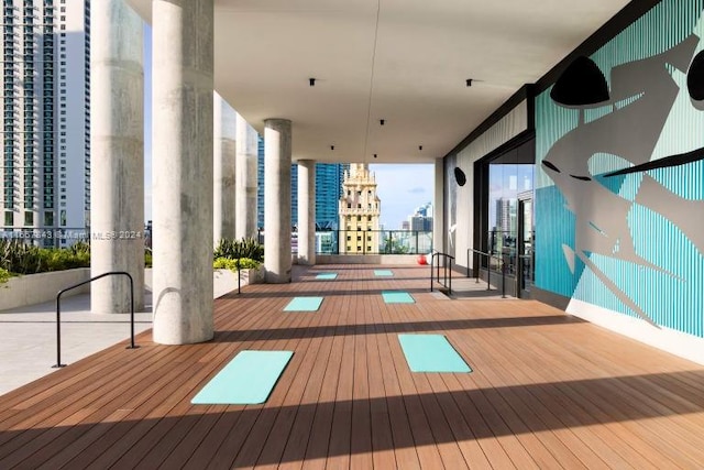 398 NE 5th St Unit 1419, Miami, FL 33132 - gym featuring hardwood / wood-style floors, a view of city, and a wall of windows