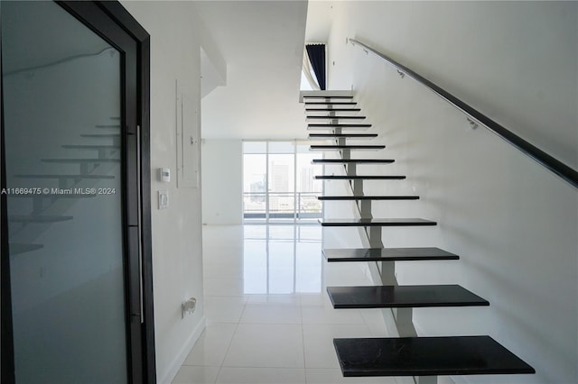 staircase with tile patterned flooring