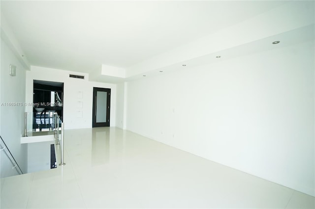 unfurnished room featuring tile patterned flooring