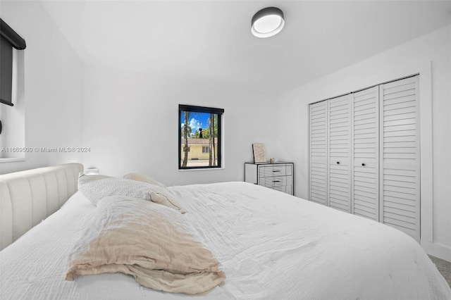 carpeted bedroom with a closet