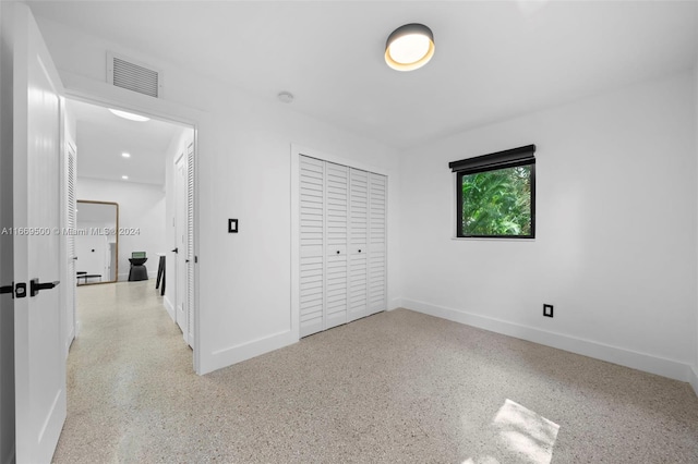 unfurnished bedroom featuring a closet