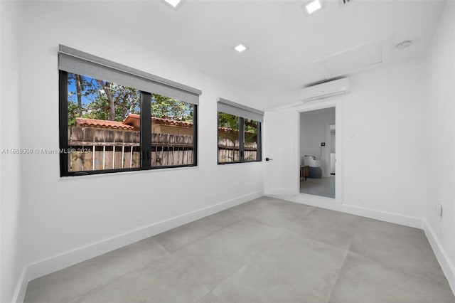 empty room featuring an AC wall unit