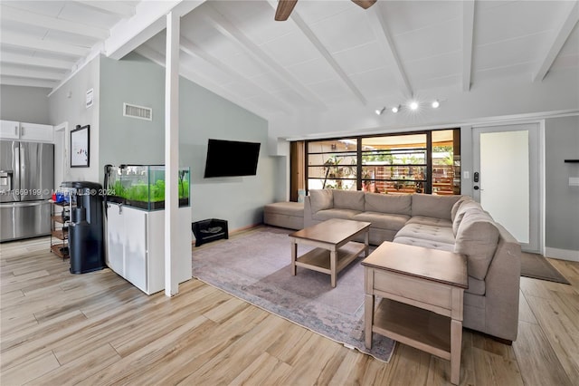 living room with vaulted ceiling with beams, light hardwood / wood-style floors, and ceiling fan