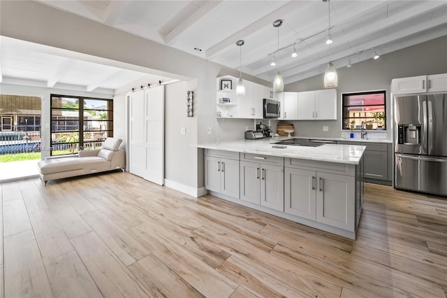 kitchen featuring pendant lighting, light wood-type flooring, white cabinetry, gray cabinetry, and appliances with stainless steel finishes