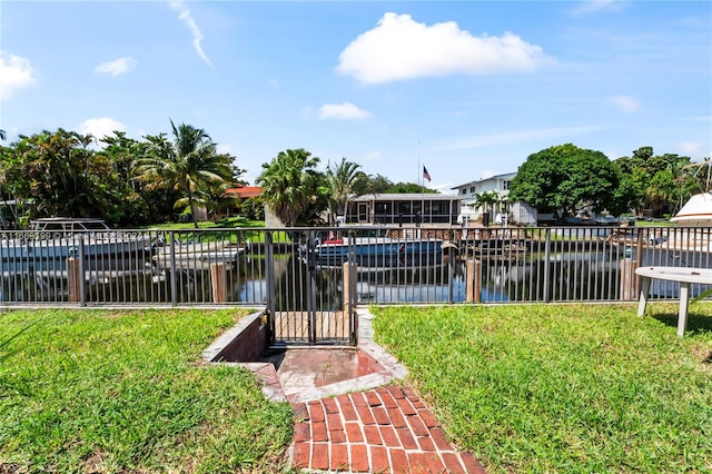 exterior space with a yard and a water view