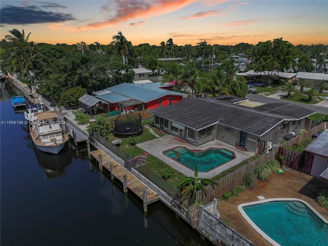 aerial view at dusk with a water view