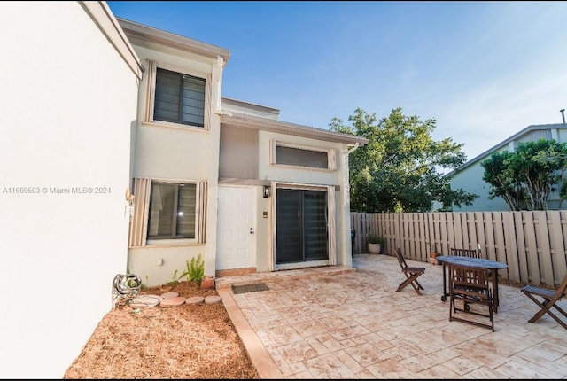 entrance to property with a patio area