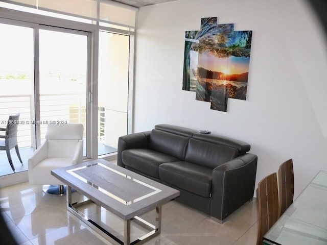 living room with light tile patterned floors and plenty of natural light