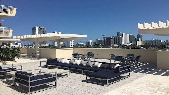 view of patio featuring an outdoor hangout area and a city view
