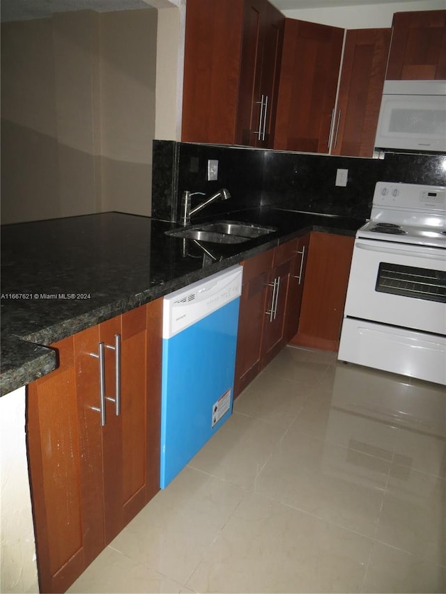 9143 SW 77th Ave Unit B403, Miami, FL 33156 - kitchen with decorative backsplash, white appliances, a sink, dark stone countertops, and light tile patterned floors