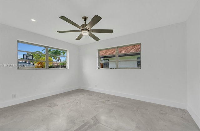 spare room with ceiling fan