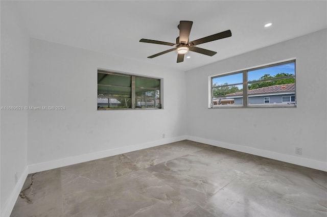 unfurnished room with ceiling fan