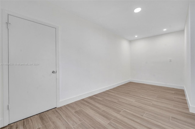 spare room featuring light hardwood / wood-style floors