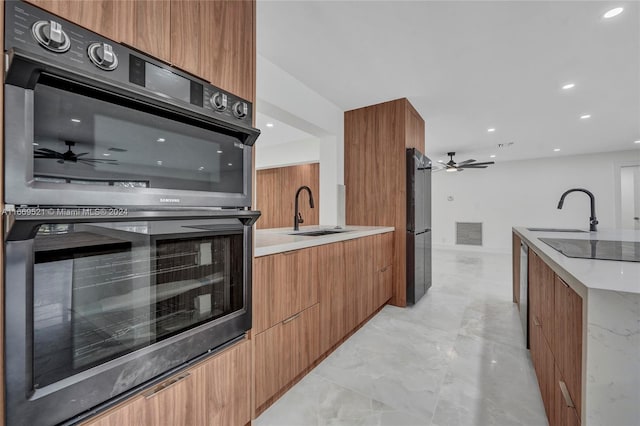 kitchen featuring black appliances and sink