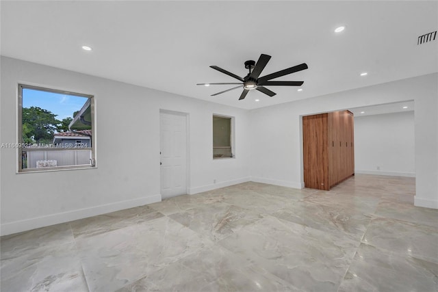 unfurnished room with ceiling fan