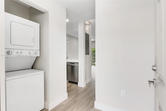 7991 NW 8th St Unit 112B, Miami, FL 33126 - washroom featuring stacked washer and clothes dryer and light wood-style flooring