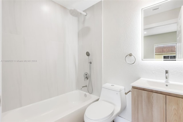 full bathroom with vanity, bathing tub / shower combination, and toilet