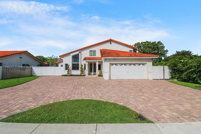 mediterranean / spanish-style home featuring a garage