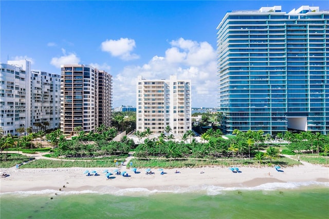 view of property featuring a view of the beach and a water view