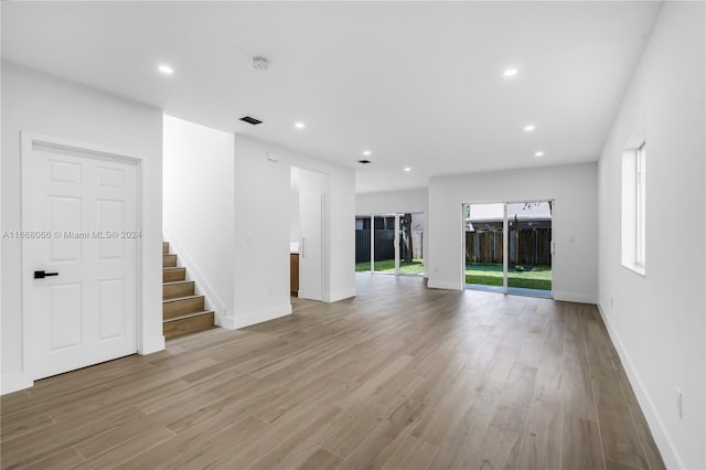 unfurnished living room featuring light hardwood / wood-style flooring