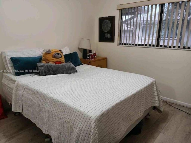 bedroom featuring hardwood / wood-style floors