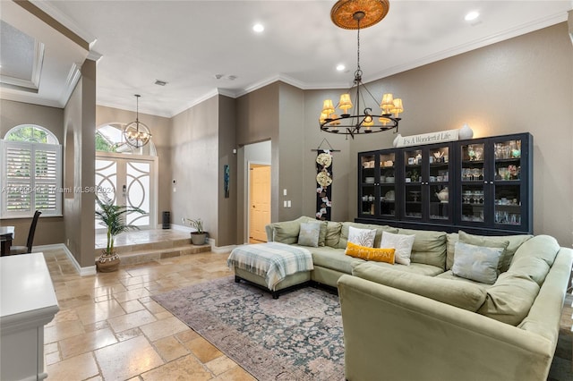 living room featuring ornamental molding and a chandelier